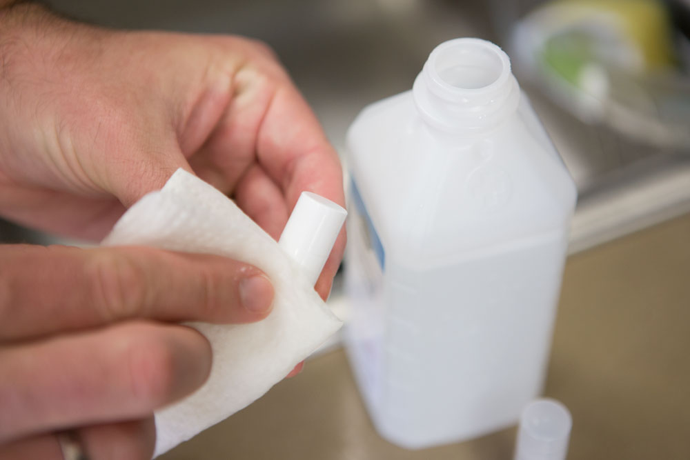 Cleaning lip balm tube with alcohol