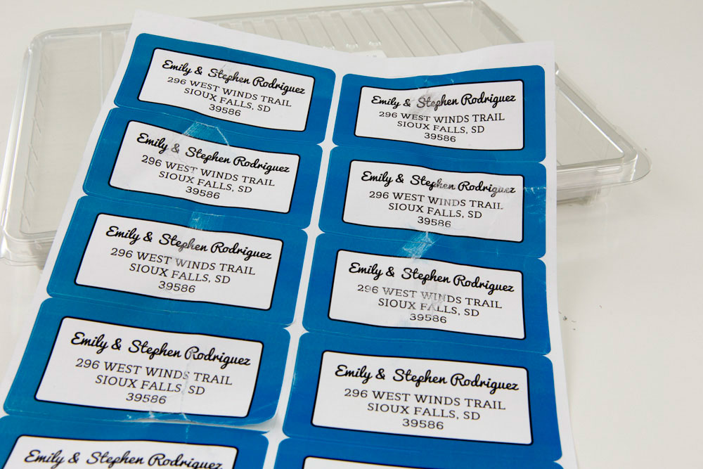 Sheet of labels with flaked toner