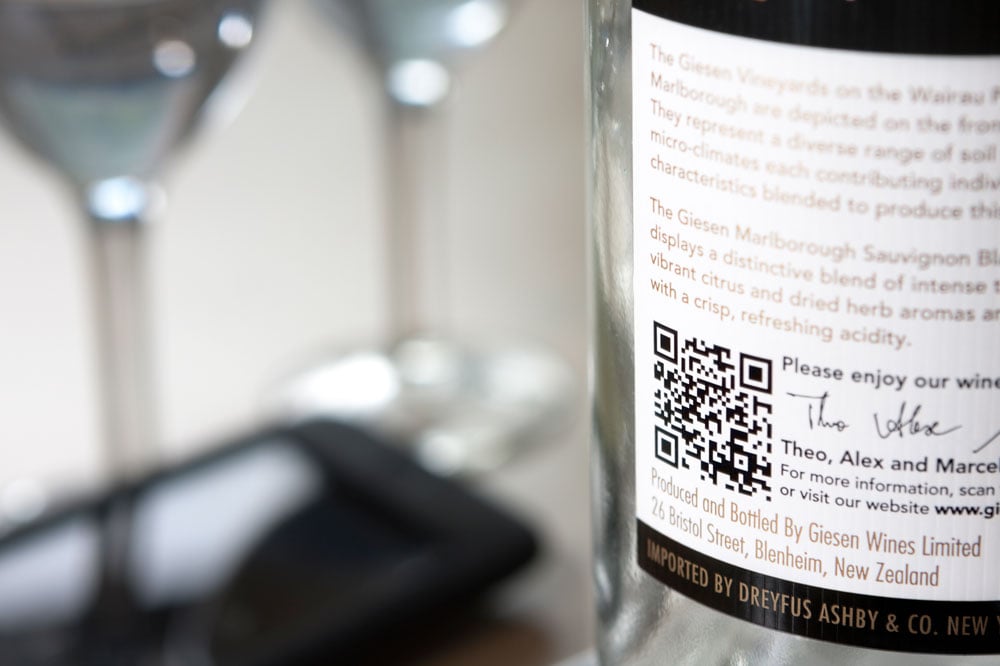 Wine bottle with QR code printed on label