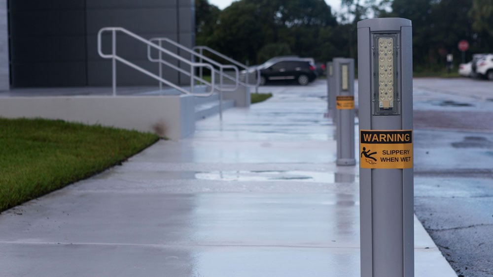 "Slippery when wet" pillars with weatherproof labels