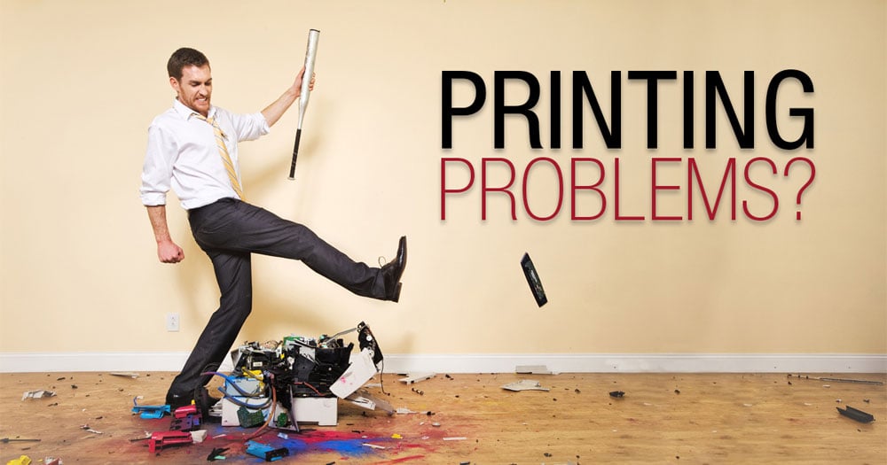 Man kicking printer - common fixes for printing problems when using labels